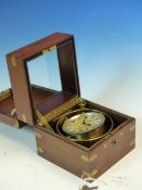 A WALTHAM WATCH Co. MARINE CHRONOMETER HOUSED IN BRASS GIMBALS WITHIN A MAHOGANY CASE. W 12.5 x D