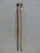 A WALKING CANE WITH A COPPER BAND INSCRIBED TO INDICATE THE WOOD AND COPPER WERE TAKEN FROM HMS