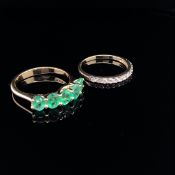 AN 18ct GOLD FIVE STONE MODERN EMERALD DRESS RING AND A 9ct GOLD CUBIC ZIRCONIA HALF ETERNITY