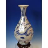 A YUAN/MING STYLE BLUE AND WHITE OCTAGONAL BOTTLE VASE AND WOOD STAND, THE DRAGON BAND ON THE BODY