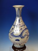 A YUAN/MING STYLE BLUE AND WHITE OCTAGONAL BOTTLE VASE AND WOOD STAND, THE DRAGON BAND ON THE BODY