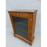 A VICTORIAN WALNUT SMALL PIER CABINET WITH SINGLE GLAZED DOOR FLANKED BY INLAID COLUMNS WITH GILT