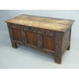 AN 18th C. OAK COFFER, THE TWO PLANK LID OVER THREE PLAIN PANELS TO THE FRONT FRAMED