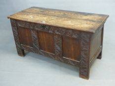 AN 18th C. OAK COFFER, THE TWO PLANK LID OVER THREE PLAIN PANELS TO THE FRONT FRAMED