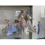 FIVE NAO FIGURINES AND ONE LLADRO FIGURINE.