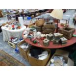 A VERY LARGE CIRCULAR CENTRE TABLE AND A CURTAIN SIDED DRESSING TABLE.