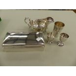 A HALLMARKED SILVER GRAVY BOAT, A SILVER CIGARETTE BOX, A SILVER BEAKER, AND TWO SILVER EGG CUPS.