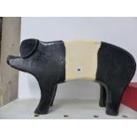 A LARGE WOODEN PIGGY BANK.