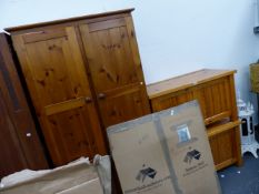 TWO PINE BLANKET CHESTS AND A PINE WARDROBE.