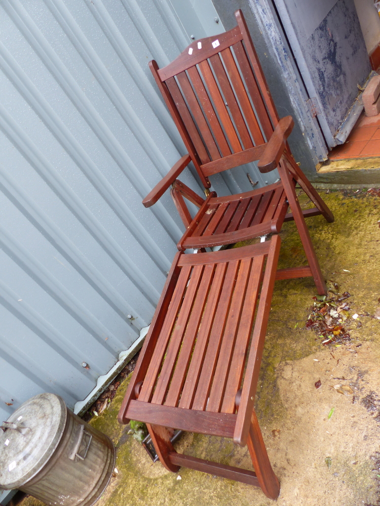 A FOLDING TEAK PATIO LOUNGER.