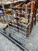 A WROUGHT IRON WINE RACK.