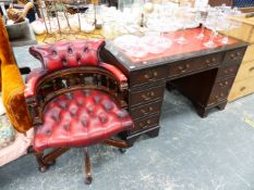 A REPRODUCTION PEDESTAL DESK TOGETHER WITH A SIMILAR BUTTON LEATHER DESK CHAIR.