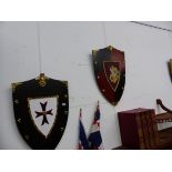 FOUR DECORATIVE WALL SHIELDS.