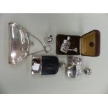 A HALLMARKED SILVER PURSE, TWO SCENT BOTTLES WITH FUNNELS, AND TWO POCKET FLASKS.