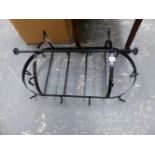 A WROUGHT IRON GAME HANGER.