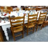 A SET OF SIX GOOD QUALITY RUSH SEAT LADDER BACK DINING CHAIRS.