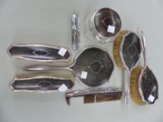 AN ANTIQUE SILVER AND PIQUE TORTOISE SHELL DRESSING TABLE SET.