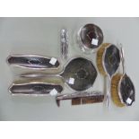 AN ANTIQUE SILVER AND PIQUE TORTOISE SHELL DRESSING TABLE SET.