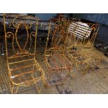 A SET OF EIGHT PAINTED WROUGHT IRON CHAIR FRAMES.