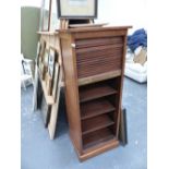 A TAMBOUR FRONTED FILING CABINET.