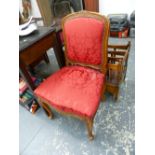 A FRENCH CARVED WALNUT BEDROOM CHAIR.