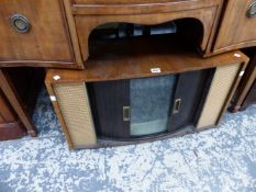 A RETO TELEVISION WITH TAMBOUR DOORS.