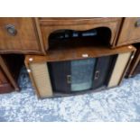 A RETO TELEVISION WITH TAMBOUR DOORS.