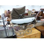 A COACHBUILT DOLLS PRAM.