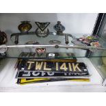 A QUANTITY OF VINTAGE CAR BADGES, NUMBER PLATES ETC.