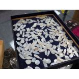 A LARGE COLLECTION OF MOTHER OF PEARL GAMING COUNTERS.