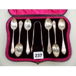 A CASED SET OF HALLMARKED SILVER TEA SPOONS AND SUGAR TONGS.