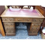 A SMALL VICTORIAN OAK PEDESTAL DESK.