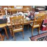A VICTORIAN WALNUT DINING TABLE AND FOUR SIMILAR CHAIRS.