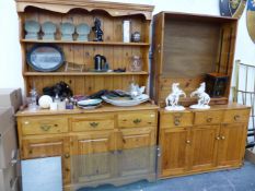 A MODERN PINE KITCHEN DRESSER, A PINE BOOKCASE, AND A SIMILAR SMALL DRESSER BASE.