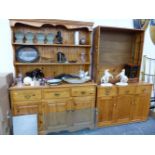 A MODERN PINE KITCHEN DRESSER, A PINE BOOKCASE, AND A SIMILAR SMALL DRESSER BASE.