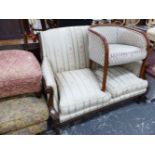 A FRENCH STYLE CARVED WALNUT SHOW FRAME SALON SETTEE.