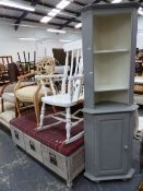 A PAINTED THREE DRAWER OTTOMAN, A ROCKING CHAIR, AND A PAINTED CORNER CABINET.