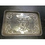 A HALLMARKED SILVER DRESSING TABLE TRAY WITH REPOUSSE DECORATION, TWO DRESSING TABLE JARS, ETC.