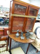 A GEORGE III MAHOGANY GATELEG TABLE ON PAD FEET, TOGETHER WITH AN EDWARDIAN BOOKCASE.