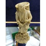 A JAPANESE CARVED IVORY FIGURE DEPICTING A SCHOLAR WITH SIGNED SIGNATURE TABLET TO BASE, TOGETHER