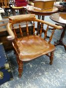 A VICTORIAN CAPTAINS CHAIR, OF GENEROUS PROPORTIONS.