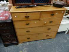 A VICTORIAN PINE CHEST OF DRAWERS.