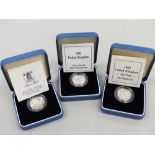 THREE SILVER PROOF COINS.