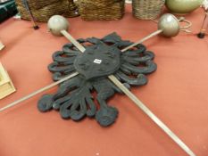 A CARVED WOOD ARMORIAL WITH CROSS SWORDS.