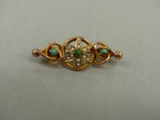 A YELLOW METAL BROOCH SET WITH SEED PEARLS AND TURQUOISE.