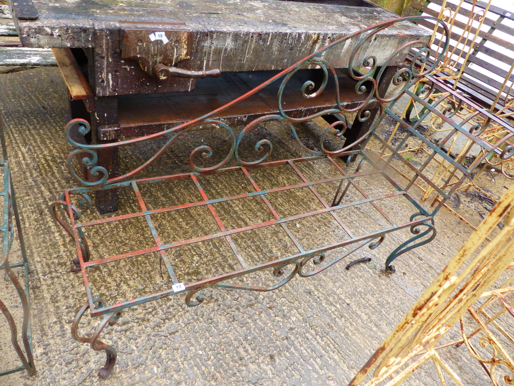 A PAINTED WROUGHT IRON CHAISE LOUNGE FRAME.