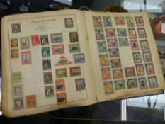 A LARGE STRAND STAMP ALBUM.