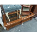 A MODERN GLASS TOP COFFEE TABLE AND A DRESSING STOOL.