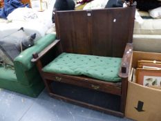 AN UNUSUAL OAK HALL SETTLE.