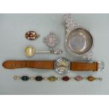 A HALLMARKED SILVER TEA STRAINER, A GENTS VINTAGE ROTARY WRIST WATCH, SILVER COIN BROOCH, A SCARAB